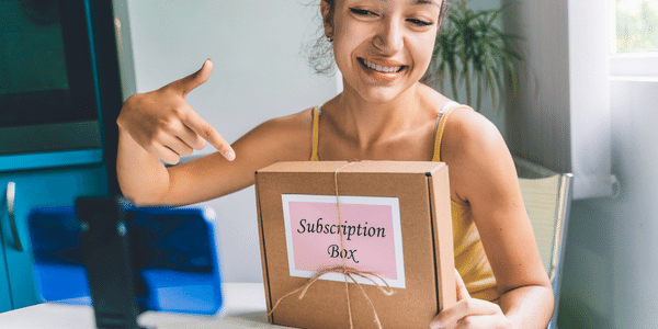 woman opening subscription box